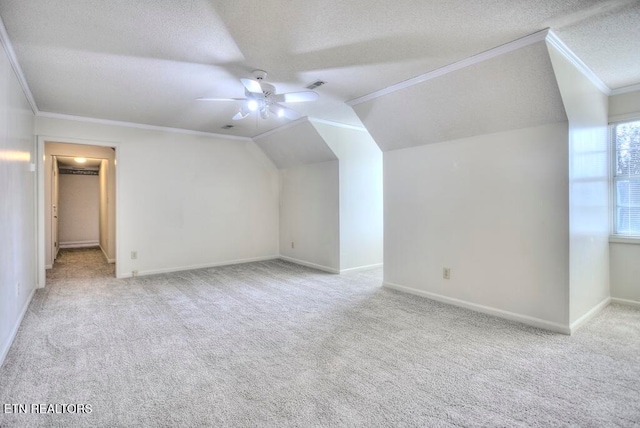 bonus room featuring lofted ceiling, light carpet, and ceiling fan