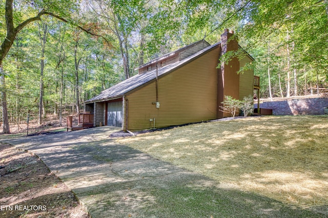 view of side of property with a yard and a wooden deck