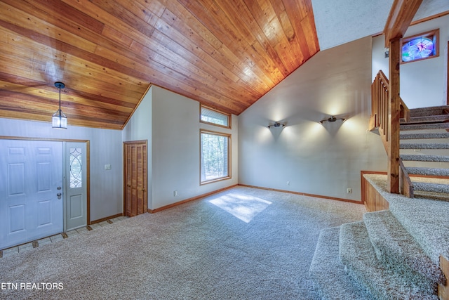 interior space with carpet, lofted ceiling, and wooden ceiling