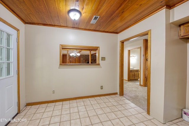 unfurnished room with wood ceiling, a notable chandelier, light tile patterned floors, and crown molding