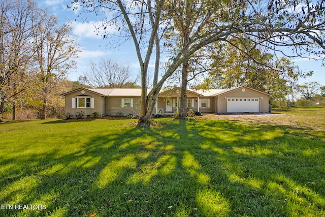 ranch-style home featuring a front yard and a garage