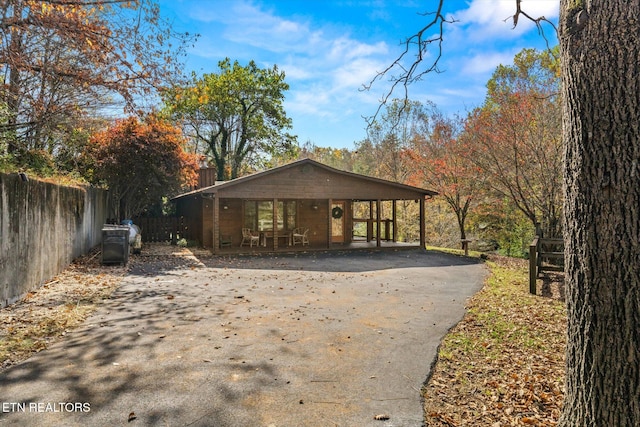 view of front of home with a carport