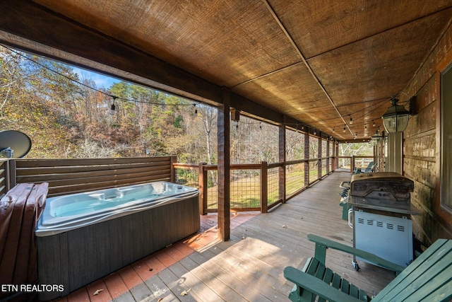 deck featuring a hot tub