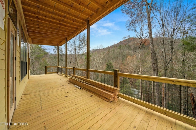 wooden deck featuring a mountain view