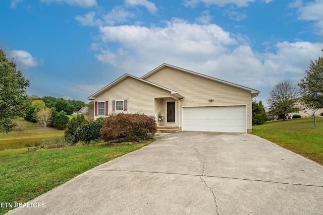 view of front of house featuring a garage and a front yard