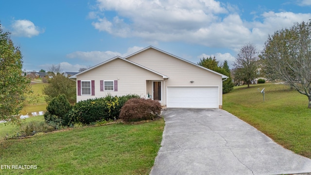 ranch-style house with a garage and a front yard