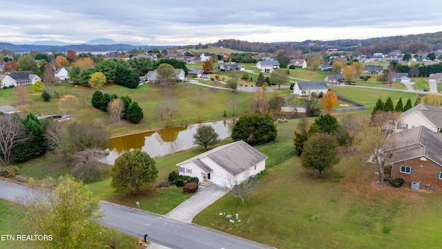 bird's eye view with a water and mountain view