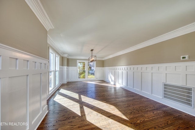 2011 Breakers Pt, Knoxville, TN 37922 - spare room featuring crown molding, a decorative wall, dark wood finished floors, a chandelier, and a wainscoted wall