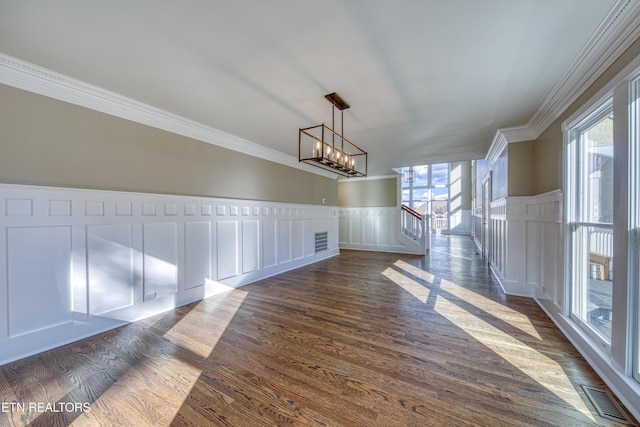 2011 Breakers Pt, Knoxville, TN 37922 - unfurnished dining area featuring healthy amount of natural light, a decorative wall, crown molding, a chandelier, and dark wood finished floors