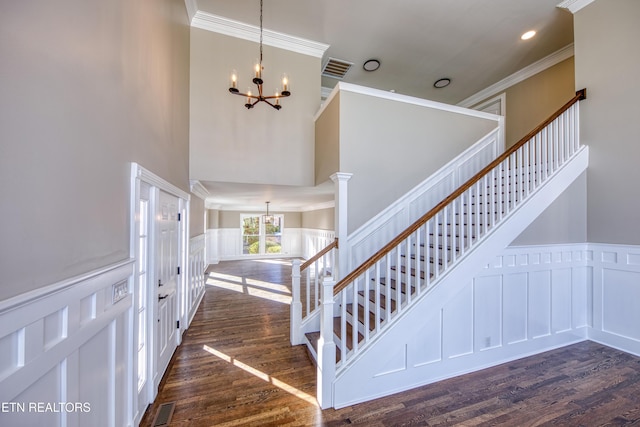 2011 Breakers Pt, Knoxville, TN 37922 - entryway with a chandelier, a decorative wall, crown molding, dark wood-style flooring, and stairs