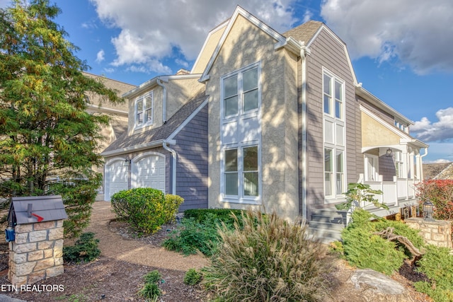 2011 Breakers Pt, Knoxville, TN 37922 - view of side of home with a porch and an attached garage