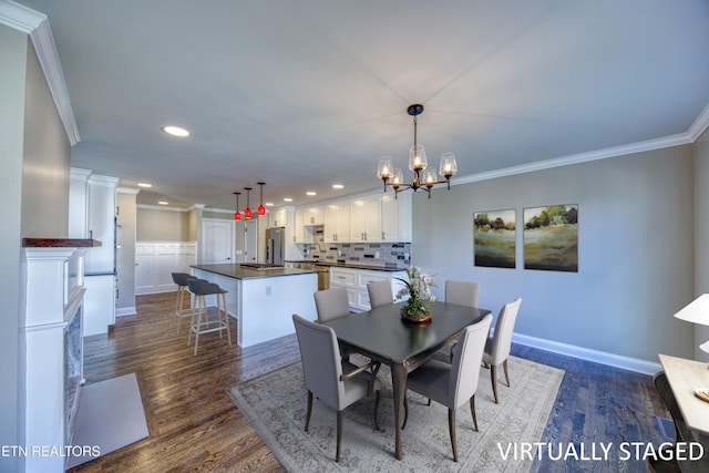 2011 Breakers Pt, Knoxville, TN 37922 - dining space with ornamental molding, a chandelier, recessed lighting, dark wood-type flooring, and baseboards