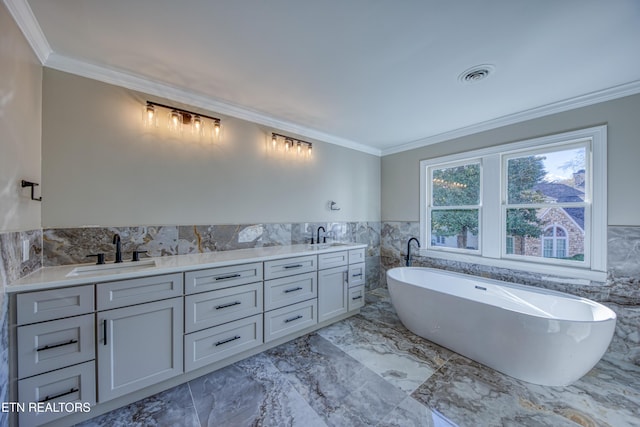 2011 Breakers Pt, Knoxville, TN 37922 - full bath with tile walls, a freestanding bath, marble finish flooring, ornamental molding, and double vanity