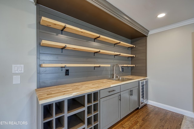 2011 Breakers Pt, Knoxville, TN 37922 - bar area with a sink, wine cooler, crown molding, dark wood-style floors, and baseboards