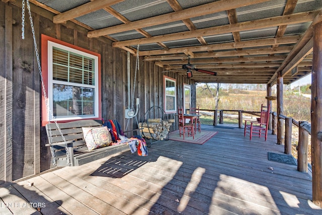 wooden deck featuring ceiling fan