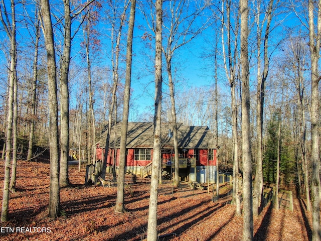 view of front of property with a wooden deck