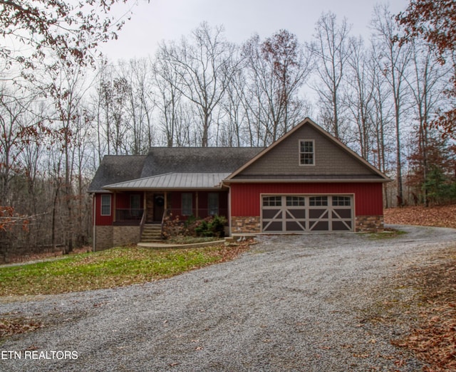 view of front of home featuring covered porch and a garage