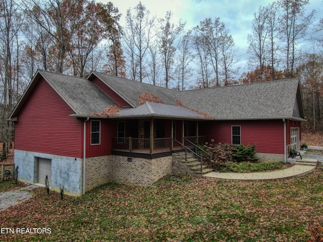 rear view of house with a porch