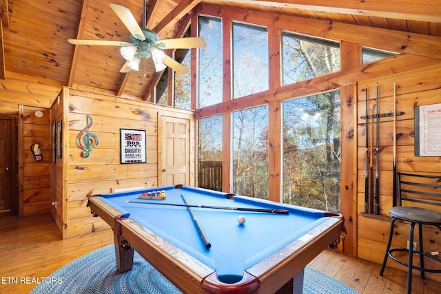 rec room featuring wood walls, ceiling fan, wood ceiling, light hardwood / wood-style flooring, and lofted ceiling with beams