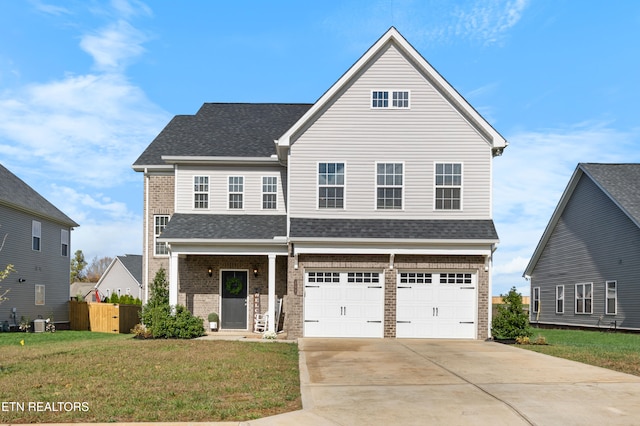 front of property with a garage and a front yard