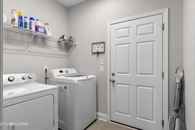 laundry area featuring washing machine and clothes dryer