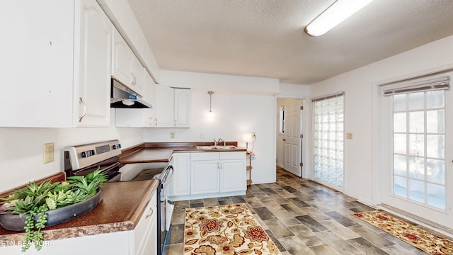 kitchen featuring a textured ceiling, electric stove, sink, and white cabinets