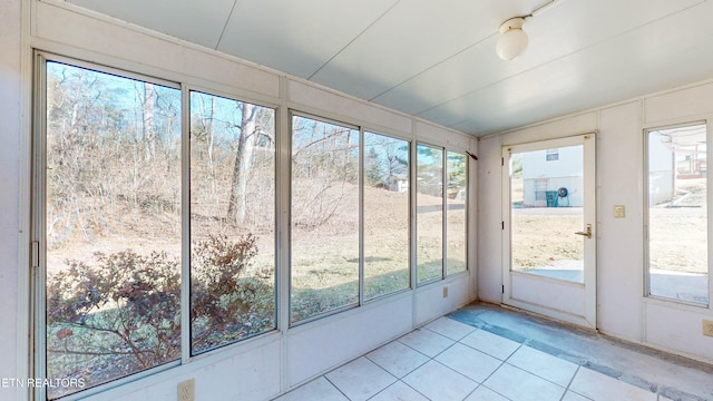 unfurnished sunroom with lofted ceiling