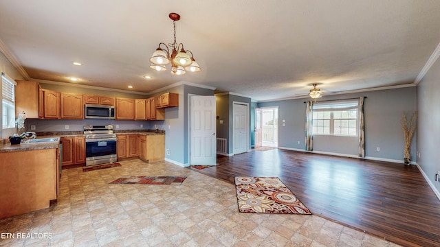 170 Mallory Dr, New Tazewell, TN 37825 - kitchen with stainless steel appliances, crown molding, baseboards, a chandelier, and a ceiling fan