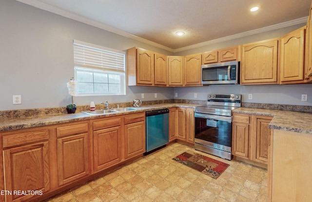 kitchen with appliances with stainless steel finishes, sink, ornamental molding, and a textured ceiling