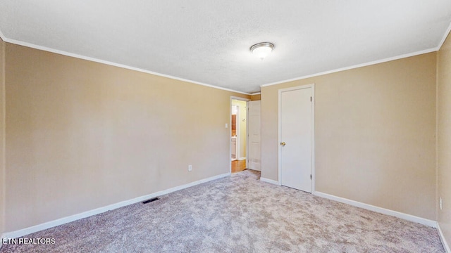 carpeted spare room with ornamental molding