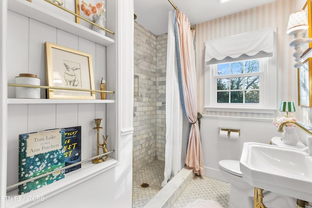 bathroom with sink, toilet, and a shower with shower curtain