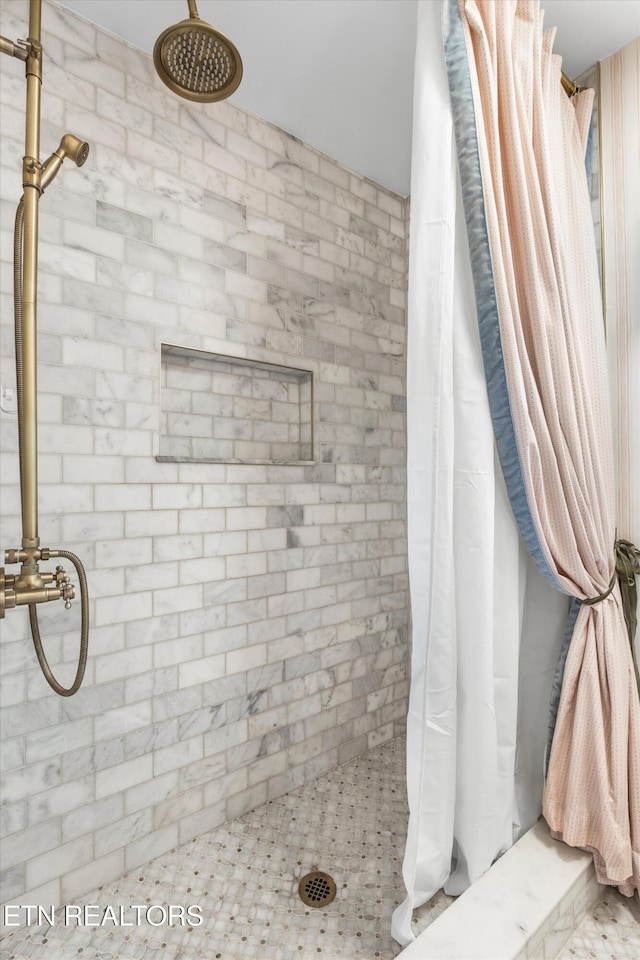 bathroom with a shower with shower curtain