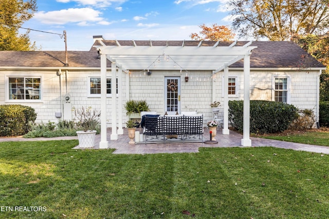 back of house featuring an outdoor living space, a yard, a pergola, and a patio area