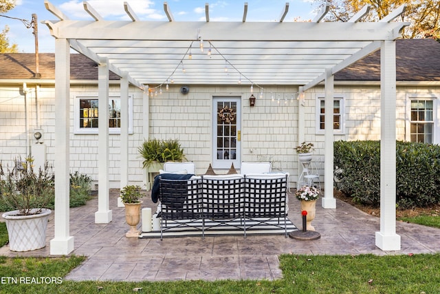 view of patio / terrace featuring an outdoor living space and a pergola