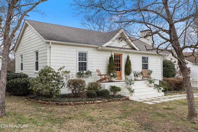 view of front of home with a front lawn