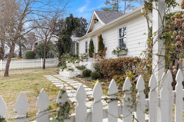 view of home's exterior with a lawn