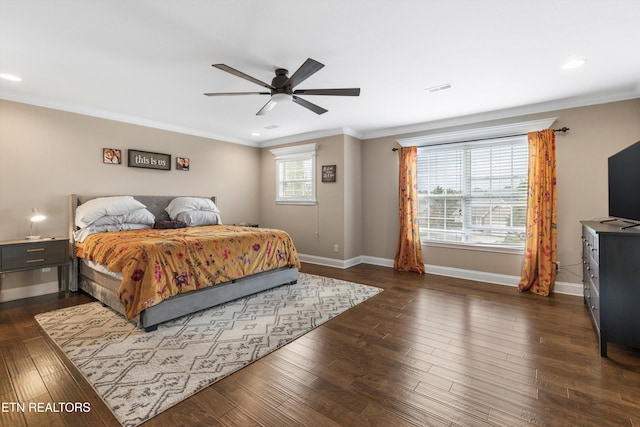 bedroom featuring ceiling fan, dark hardwood / wood-style flooring, and ornamental molding