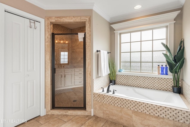 bathroom featuring separate shower and tub, tile patterned floors, and ornamental molding