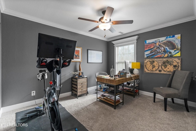 carpeted home office with crown molding and ceiling fan