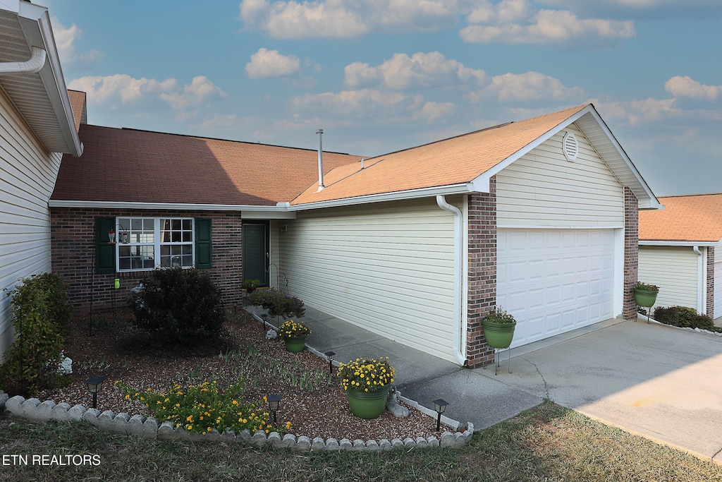 single story home featuring a garage