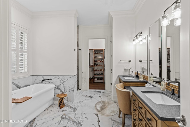 bathroom featuring a tub to relax in, vanity, tile walls, and ornamental molding