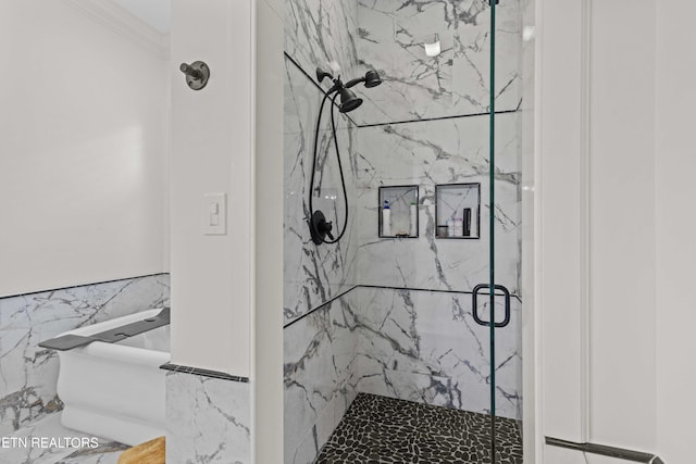 bathroom featuring an enclosed shower and tile walls