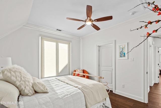 bedroom featuring dark wood-type flooring, ceiling fan, and ornamental molding