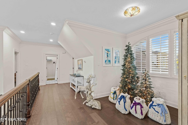 hallway with dark hardwood / wood-style flooring and crown molding