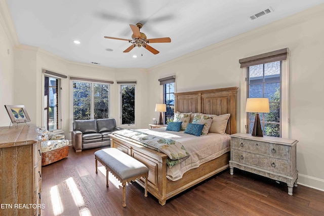 bedroom featuring ornamental molding, dark hardwood / wood-style flooring, and ceiling fan