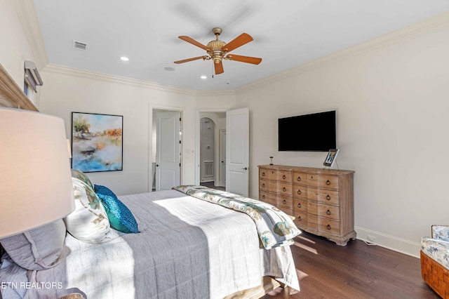 bedroom with ornamental molding, ceiling fan, and dark hardwood / wood-style floors