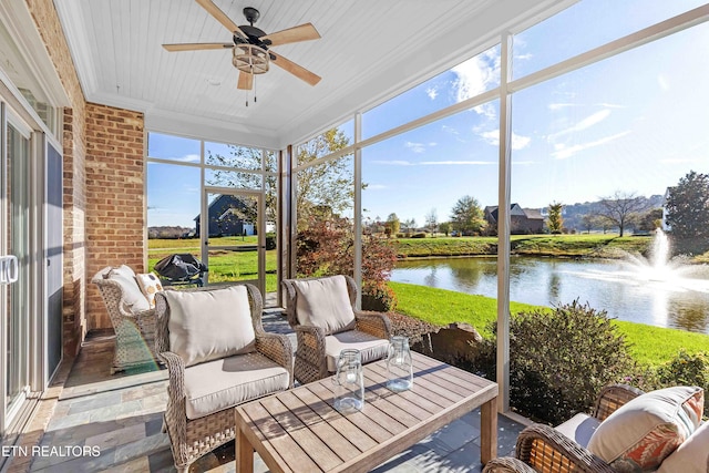 sunroom featuring a water view, wood ceiling, and ceiling fan