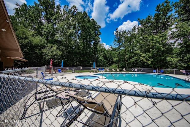 view of swimming pool featuring a patio