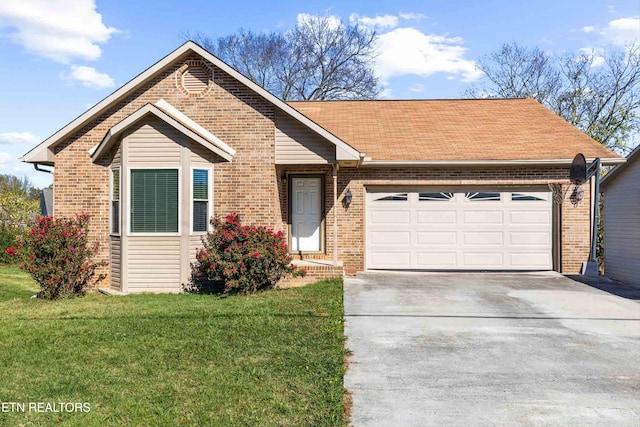 ranch-style house featuring a front yard and a garage