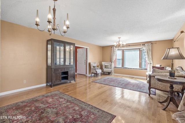 foyer featuring light hardwood / wood-style floors and a textured ceiling